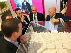 Delegates at MIPIM 2012 looking at plans for Paradise Circus Birmingham